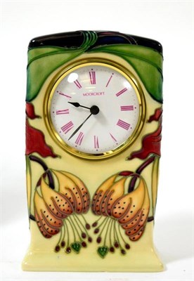 Lot 231 - A modern Moorcroft Anna Lily pattern clock, designed by Nicola Slaney, impressed factory marks,...