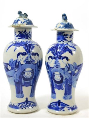 Lot 235 - A 19th century blue and white matched vase and cover (a.f.)