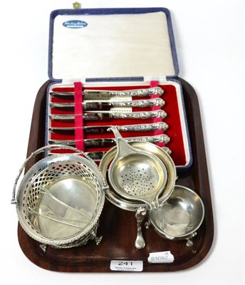 Lot 241 - A small quantity of silver including a pierced basket, a strainer, sugar tongs, etc