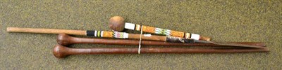 Lot 250 - Two Zulu staffs, a Knobkerrie with beadwork shaft and a similarly decorated asagai