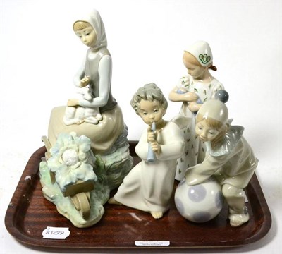 Lot 281 - Three Lladro figures comprising a girl with wheelbarrow, girl with ball, angel with flute and a...