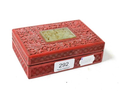 Lot 292 - A lacquered cinnabar box set, lid set with a jade type plaque