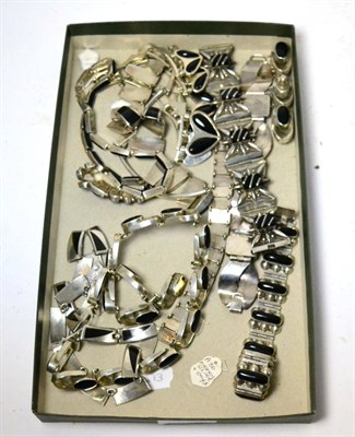 Lot 293 - A group of Mexican silver jewellery including five bracelets and five necklaces all decorated...