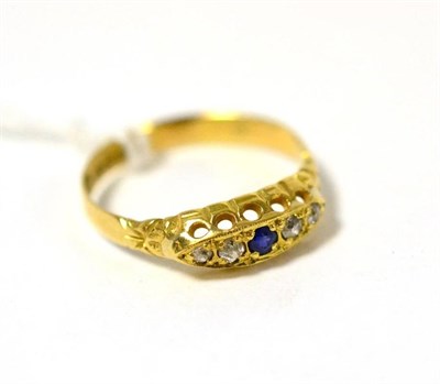 Lot 301 - An 18ct gold sapphire and diamond three stone ring