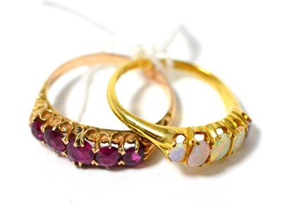 Lot 323 - An 18ct gold opal five stone ring and a ruby five stone ring