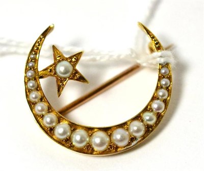 Lot 327 - A split pearl set crescent brooch