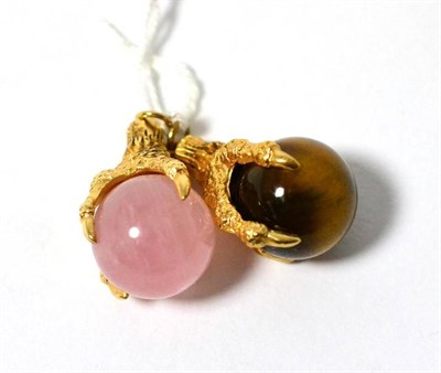 Lot 338 - Two 9ct gold claw pendants, one set with rose quartz, the other with tiger's eye