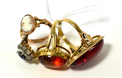 Lot 340 - Two amber set rings, a 9ct gold cameo set ring and another ring