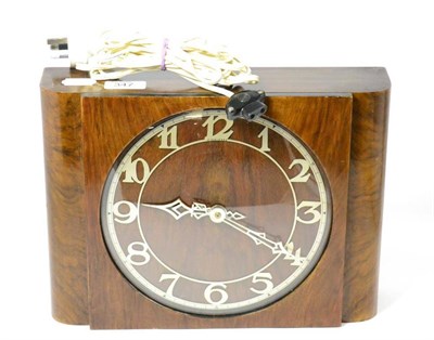 Lot 347 - An Art Deco electric clock retailed by Finnigans and a Zenith timepiece in a fitted case (2)