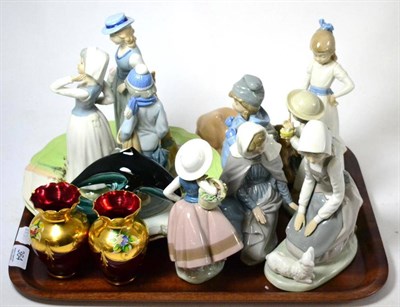 Lot 364 - Two Lladro figures, six Nao figures, Poole dolphin, two Royal Doulton hunting plates and a pair...