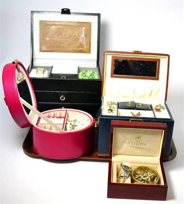 Lot 395 - A large quantity of silver, white metal and costume jewellery in five jewellery cases