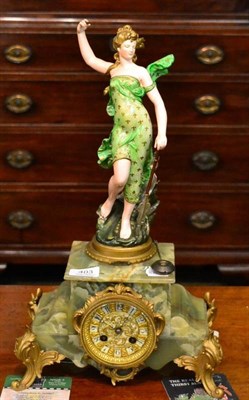 Lot 403 - A green onyx spelter figural mantel clock