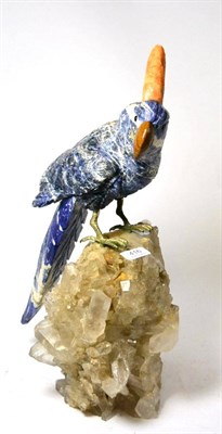 Lot 416 - A carved mineral cockatoo on a naturalistic geode base