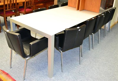 Lot 1008 - Italian grey laminate extending dining table and a set of ten Italian black leather dining chairs