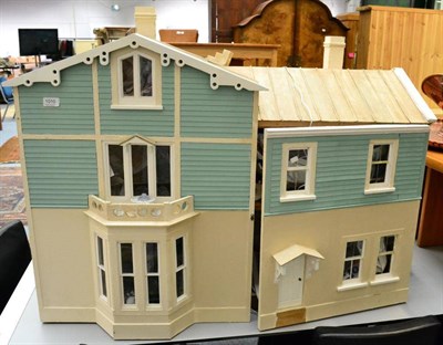 Lot 1010 - A green painted dolls house