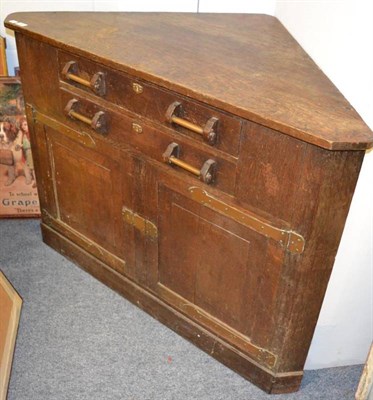 Lot 1021 - An Arts & Crafts corner cupboard