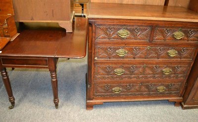 Lot 1023 - A carved oak chest of drawers and two mahogany tables (3)