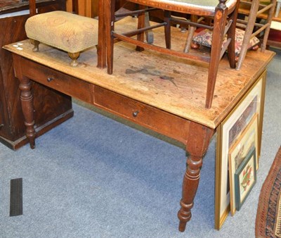 Lot 1026 - A late 19th/early 20th century library table with two drawers