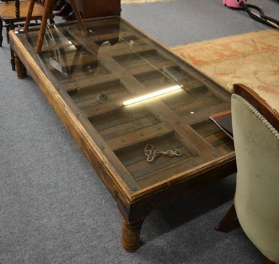 Lot 1036 - A Moroccan door coffee table