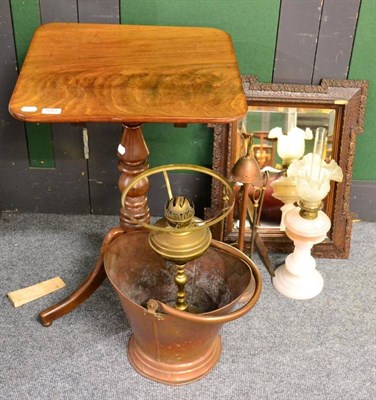 Lot 1043 - A 19th century mahogany occasional table together with two oil lamps, a wall mirror, a copper...