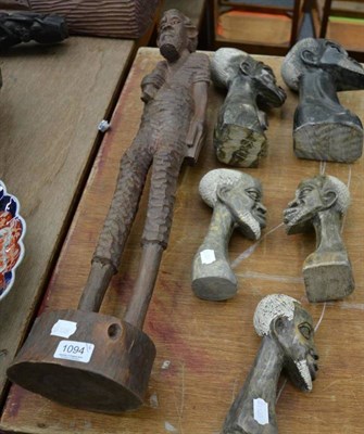 Lot 1094 - Five African soapstone busts and a large carved wood figure of a man (6)