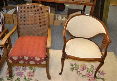 Lot 1127 - Mahogany inlaid tub chair and a caned back armchair