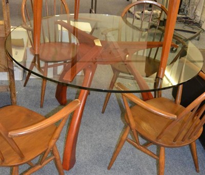 Lot 1135 - A CJI dining table, designed by Andre Marx, Angelin Armargo base with toughened circular glass top