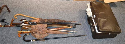 Lot 1158 - Two silver mounted ebonised walking sticks, a shooting stick, four various walking sticks, four...