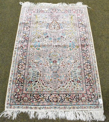 Lot 1166 - Finely woven Chinese silk prayer rug, the coral pink field centred by an urn issuing flowers...