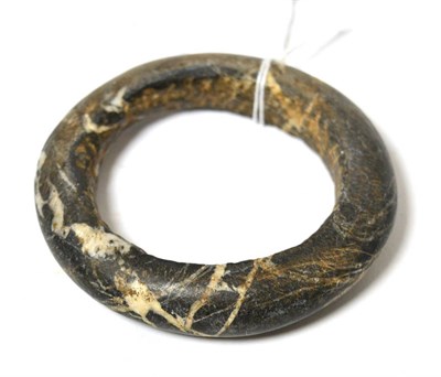 Lot 2 - A Neolithic Sub-Saharan African carved stone bangle, 9.9cm dia
