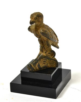 Lot 5 - A Roman bronze model of an eagle resting on a boar's head, 2nd century, 5.4cm high (bronze only)