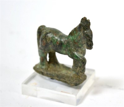 Lot 6 - A Roman model of a horse, 2nd/3rd century AD, 5cm wide