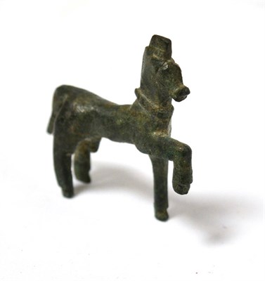 Lot 8 - A Greek bronze horse modelled in the round, 1st/2nd century BC, 5cm wide