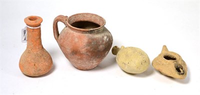 Lot 11 - A Roman terracotta jug 3rd/5th century AD, 10cm high, together with a Roman terracotta oil lamp...