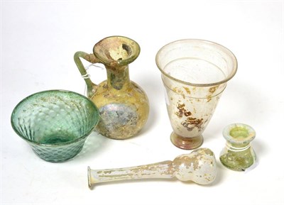 Lot 12 - A Roman glass jug, circa 2nd-3rd century AD, 9.5cm high, a Roman glass alabastron of similar...