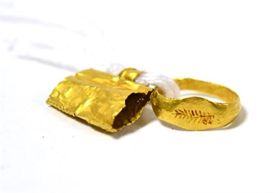 Lot 13 - A Roman high carat gold baby's ring, along with a further Roman gold pendant in the form of a chest