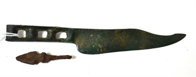 Lot 20 - A European Iron Age Hallstatt bronze knife blade circa 800-600 BC, the blade curved and handle...