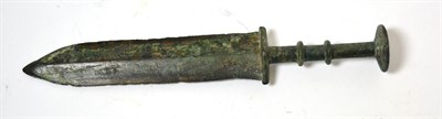 Lot 21 - A Chinese bronze Warring States period short sword and dagger, circa 400-200 BC, the handle...