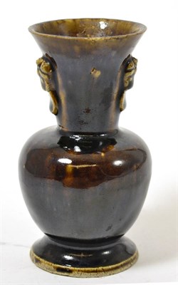 Lot 26 - A Chinese Han style monochrome brown pottery vase, possibly late Ming Dynasty, having tapering...