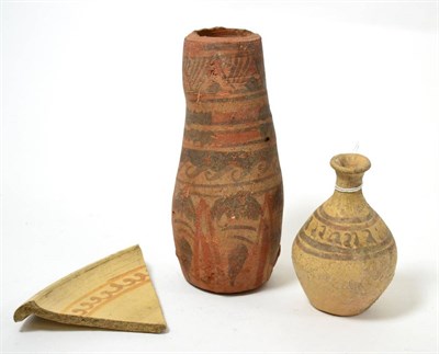 Lot 32 - A Syrian painted terracotta bottle, circa 8th-10th century AD, having stylised bands of...