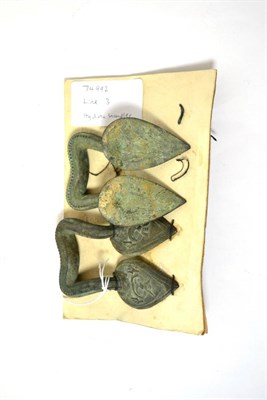 Lot 43 - A pair of Roman bronze hydria handles, circa 100 BC-100 AD, each handle shaped and with cast...