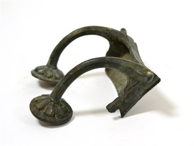 Lot 46 - A Roman bronze bracket with decorated handle like supports, circa 1st-2nd century AD, the...