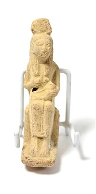 Lot 49 - An Egyptian terracotta model of Isis holding the baby Horus, late period 664-30 BC, modelled in the