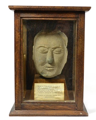 Lot 54 - An English medieval carved stone head of a cleric, circa 14th century, carved almost in the...