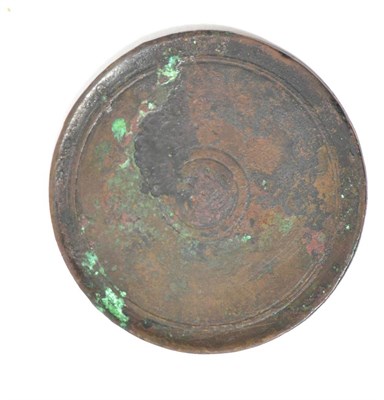 Lot 59 - A Chinese bronze mirror, possibly Ming Dynasty, having moulded edge and central circular...