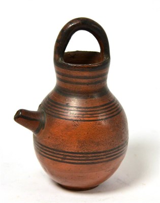 Lot 64 - An Eastern Mediterranean or Ancient Greek style wine vessel, with continuous circular...