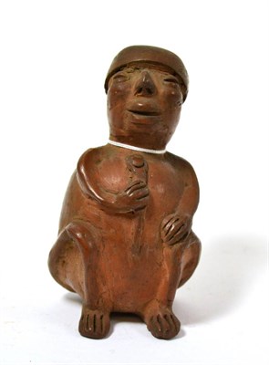 Lot 69 - A Syrian terracotta seated figure, 11th-14th century style, modelled in the round with stylised...