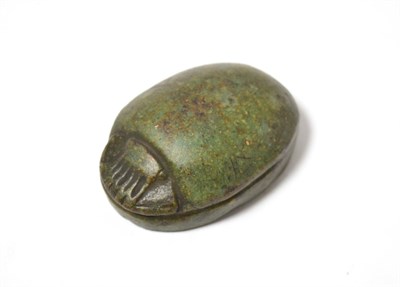 Lot 75 - An Egyptian carved green stone heart scarab, possibly Third Intermediate Dynasty, Circa...