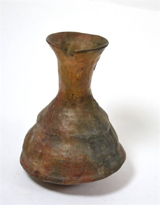 Lot 76 - An Eastern Mediterranean terracotta conical shaped vase, circa 100-500BC, the neck of flared...