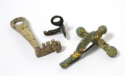 Lot 84 - A Roman gilded bronze bow brooch fibula, circa 2nd-3rd century AD, 7cm wide, with an early bat form